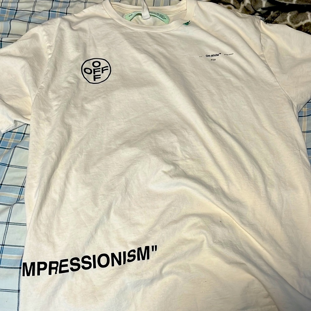 Over sized off white shirt it’s a medium but it’s really big
